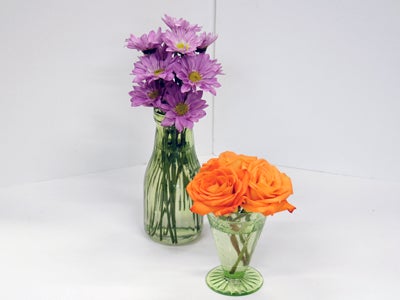 Purple and Orange Bouquet Two Weeks Later Separated into Two Vases 